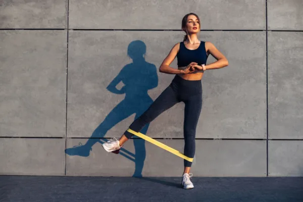 Woman using bands to exercise